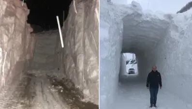 Kar kütlesinin içerisinden açılan tünelle ulaşım sağlandı