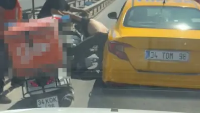Taksiciyle motokurye arasında yol verme kavgası