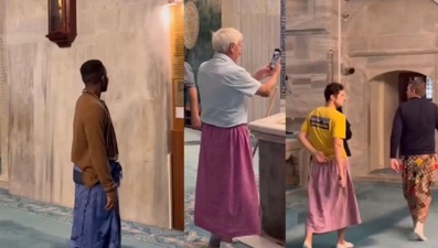 Camide etek giyen erkek turistler gündem oldu: Kuralı yanlış anladıkları sanıldı
