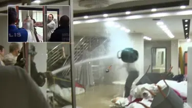 Eşinin mağazasını basıp gelinlikleri yakmaya çalıştı: Tazyikli suyla durdurdular!