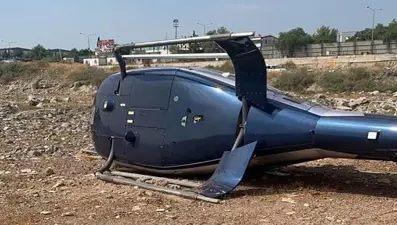 İzmir'de arızalanan helikopter iniş sırasında yan yattı