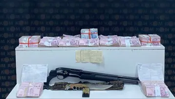 Tefecilik operasyonunda yatağın altından poşetler dolusu para çıktı