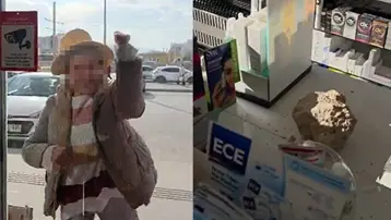 Fark ücreti vermek istemeyen kadın eczaneye taşla saldırdı