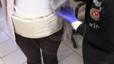 Beline sardığı onlarca cep telefonuyla sınırda yakalandı