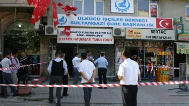 Soyguncu veznedarı başından vurdu