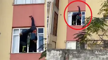Anahtarını unuttuğu eve girmeye çalışırken asılı kaldı