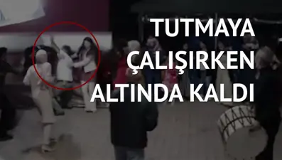 Halay çekenleri kurtarmak isterken üzerine tente düştü