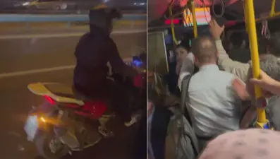 Seyir halindeki otobüsün camını kırdı
